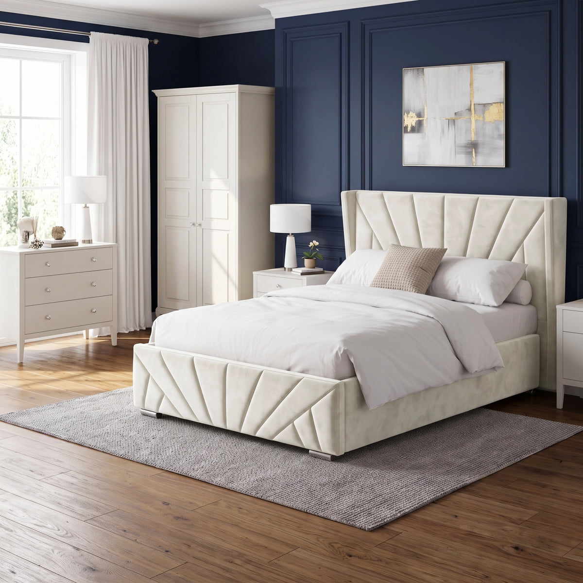 [Double | Beige] Full bedroom setting with the Sunrise Double Ottoman Storage Bed Frame Beige Velvet against a navy accent wall.