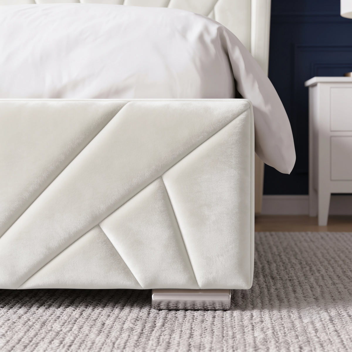 [Double | Beige] Close-up detail of the chrome corner foot and sunburst stitching on the Sunrise Double Ottoman Storage Bed Frame Beige Velvet.