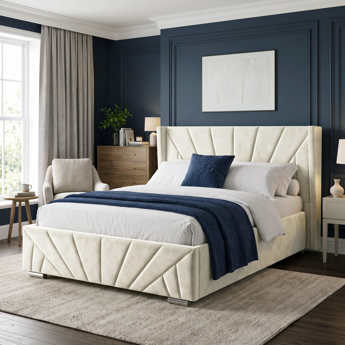 [King | Beige] Angled view of the Sunrise King Ottoman Storage Bed Frame Beige Velvet styled with blue bedding accents.
