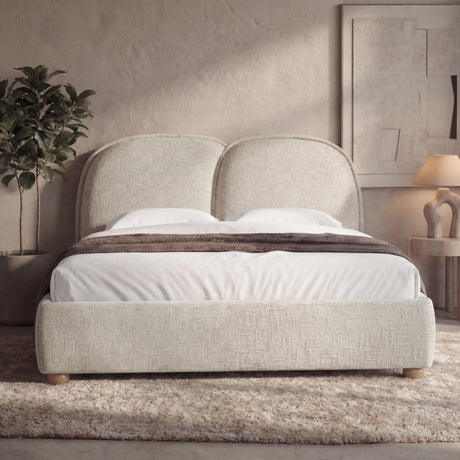 [King | Beige] Upholstered bed frame with a soft padded headboard and wooden legs in a natural light bedroom setting