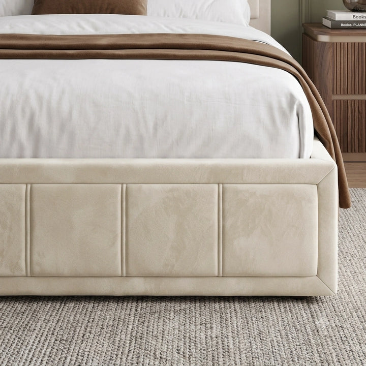 [Double | Beige] upholstered bed frame in a beige tone, shown with white bedding and a brown throw blanket in a styled bedroom setting.