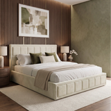 [King | Beige] A modern upholstered bed with a tufted cream headboard and matching footboard, styled in a contemporary bedroom with a wood slat accent wall, side tables, lamps, and abstract wall art.