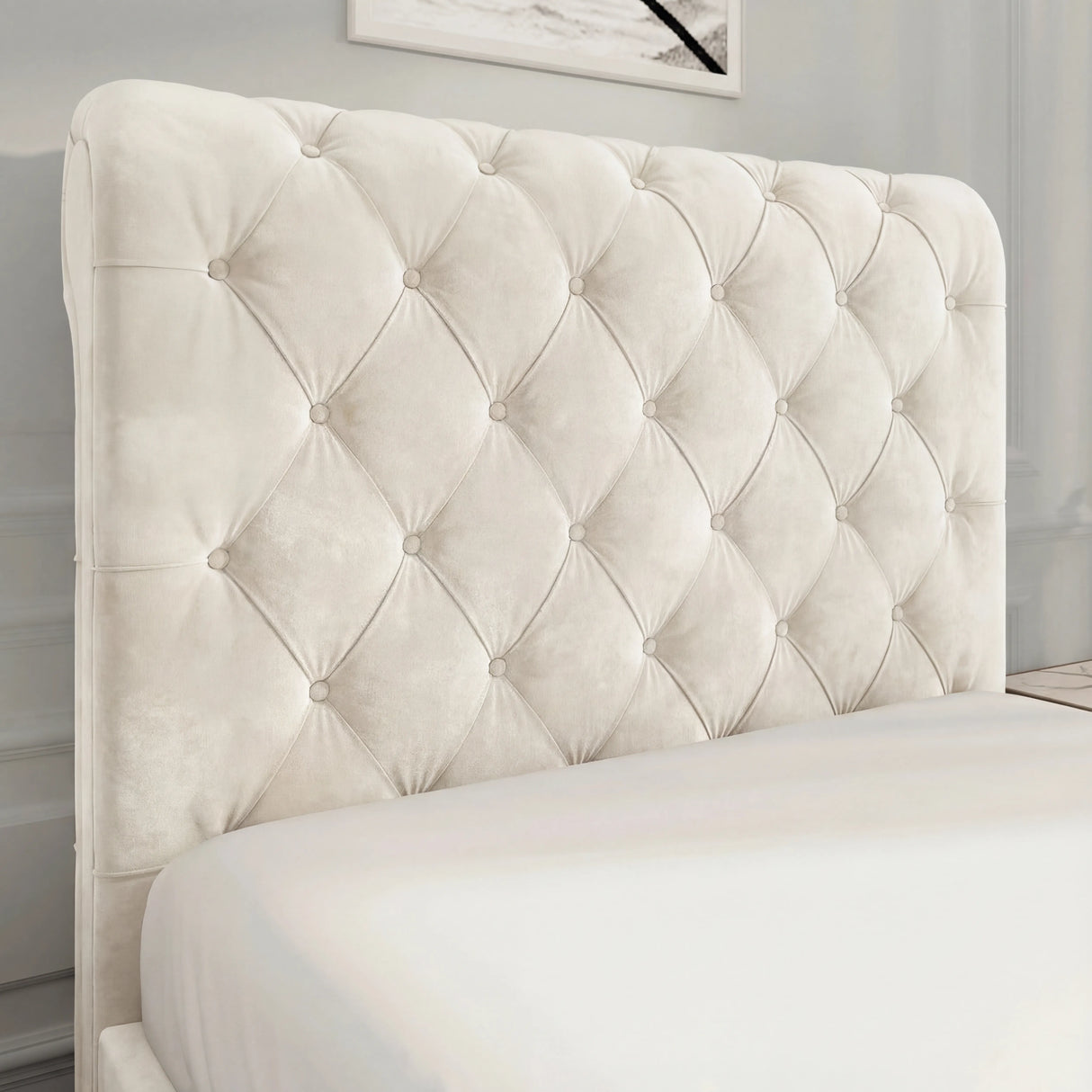 Close-up of beige Chesterfield-style headboard with deep button tufting and soft velvet finish, adding luxury to any bedroom.