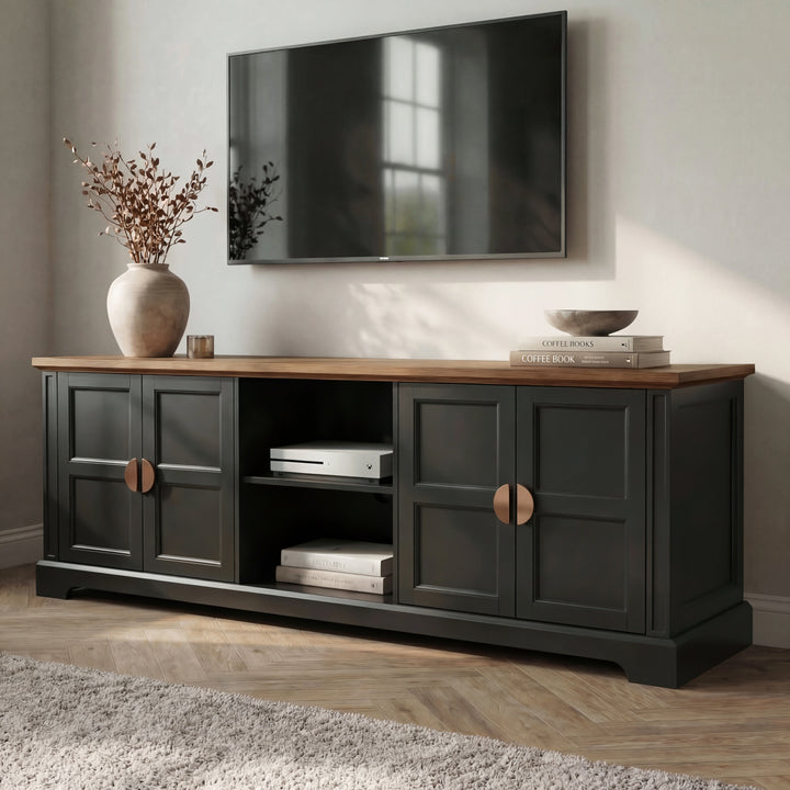 [Black] Bellford TV unit at an angle showing depth of cabinet, oak top overhang, copper handles on shaker doors