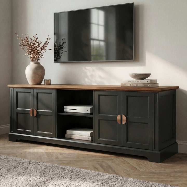 [Black] Bellford TV unit at an angle showing depth of cabinet, oak top overhang, copper handles on shaker doors