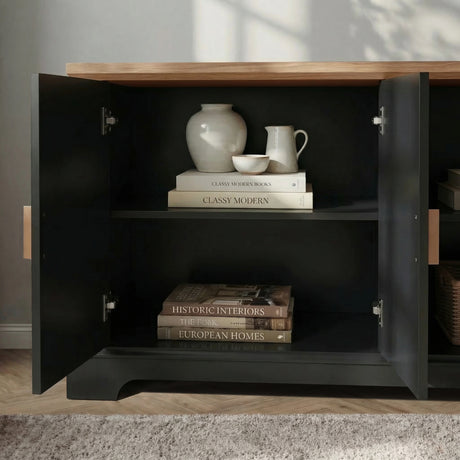 [Black] Bellford TV unit left cabinet door swung open, two internal shelves with ceramic jug, vase and books