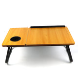 Best pine brown laptop table for bed, offering an adjustable and foldable design for working or relaxing comfortably on your bed.