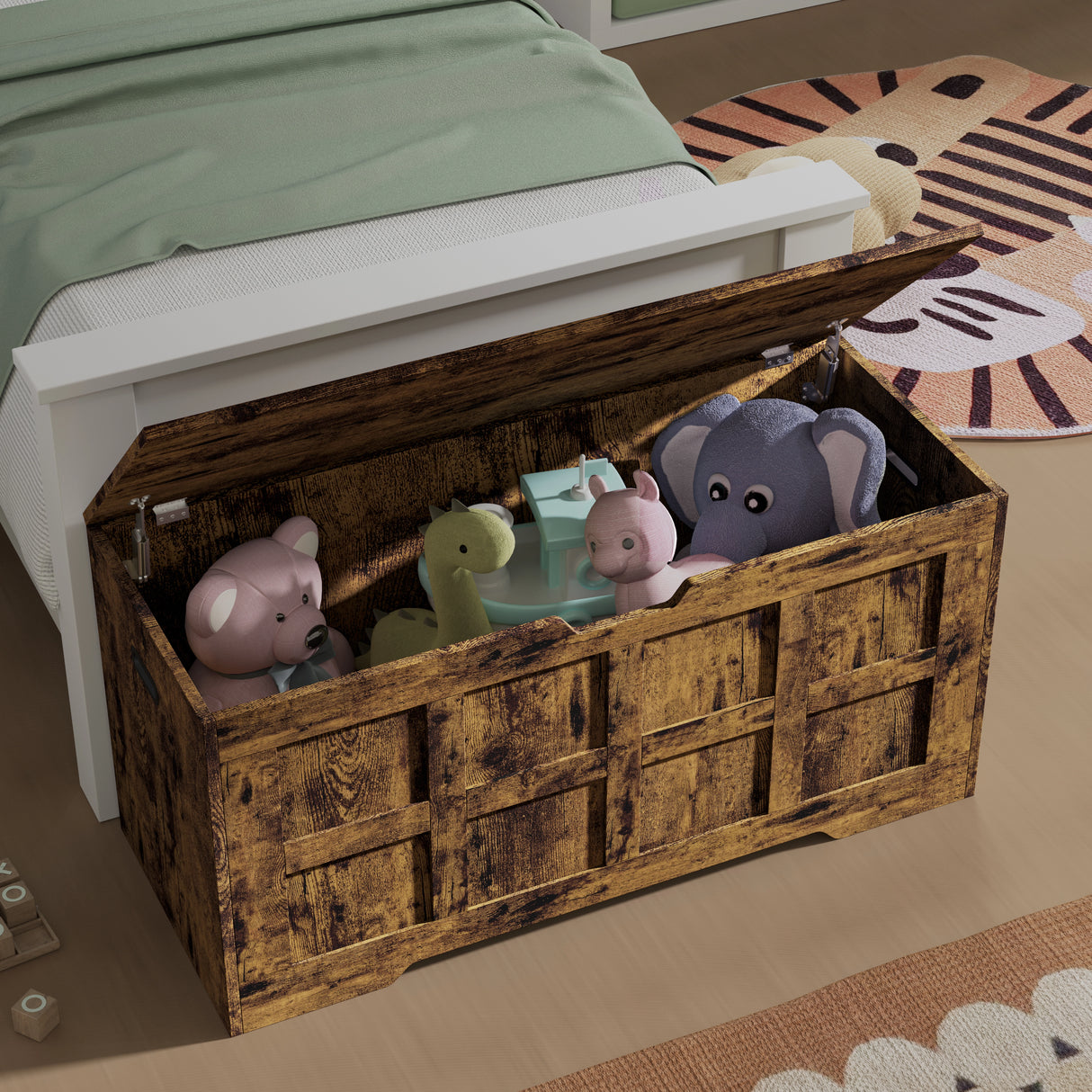 Storage Chest - Shaker Style Blanket or Toy Box With Lid & Safety Hinges in rustic wood finish, placed at the foot of a bed and filled with plush toys.