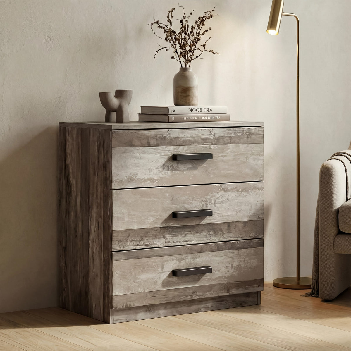 [Ash Grey] three drawer chest positioned in room with textured finish and black wooden bar handles