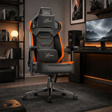 [Black + Orange] gaming chair with the Xstriker logo on the headrest, backrest, and lumbar support, positioned in a modern, dimly lit home office setup.