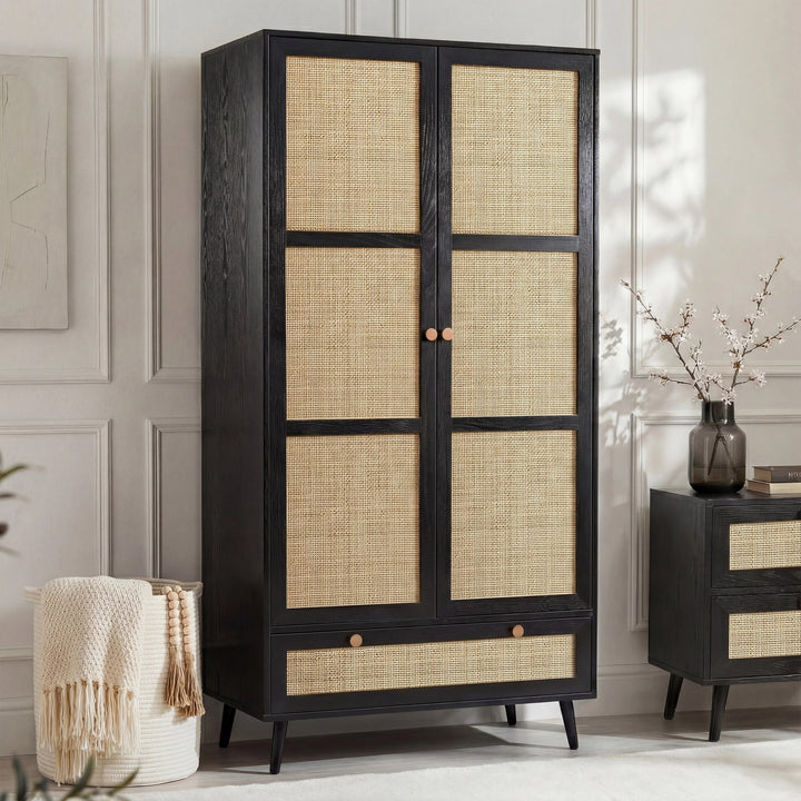 [Black] Wovena rattan wardrobe with both doors open showing hanging rail of clothes and pull-out base drawer