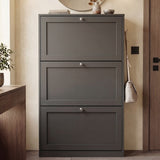 [Grey] Shaker Shoe Cabinet closed three-door flip-front unit in warm neutral hallway with round mirror above and ceramic vase and books on top