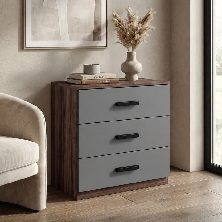 [Walnut] three drawer chest placed in room with dual tone finish and matte black wooden handles