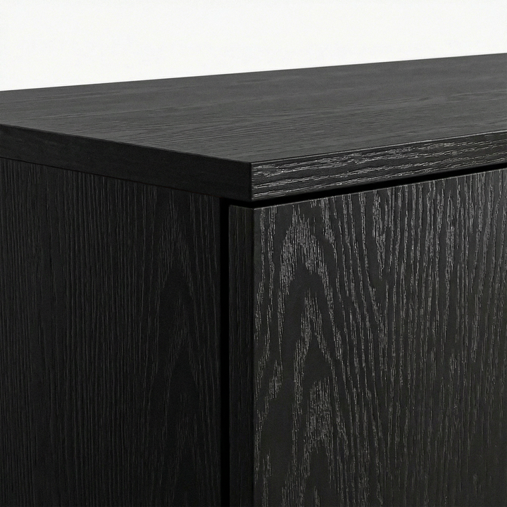 [Black] Top panel corner detail of black wardrobe highlighting surface texture and sharp edges