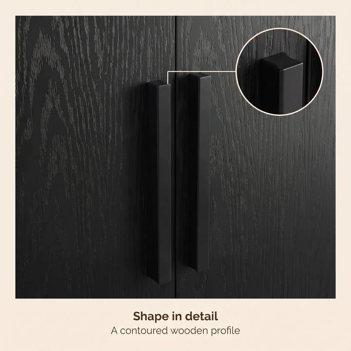 [Black] Close-up of twin vertical handles on textured doors with inset handle shape detail