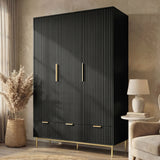 Black three door wardrobe with drawers positioned in room corner beside chair and neutral decor