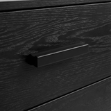 [Black] Close up of black drawer front with black wooden handle detail and visible wood grain texture of chest