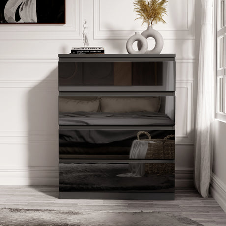[Black] black four drawer chest with reflective high gloss finish and decorative items on top surface