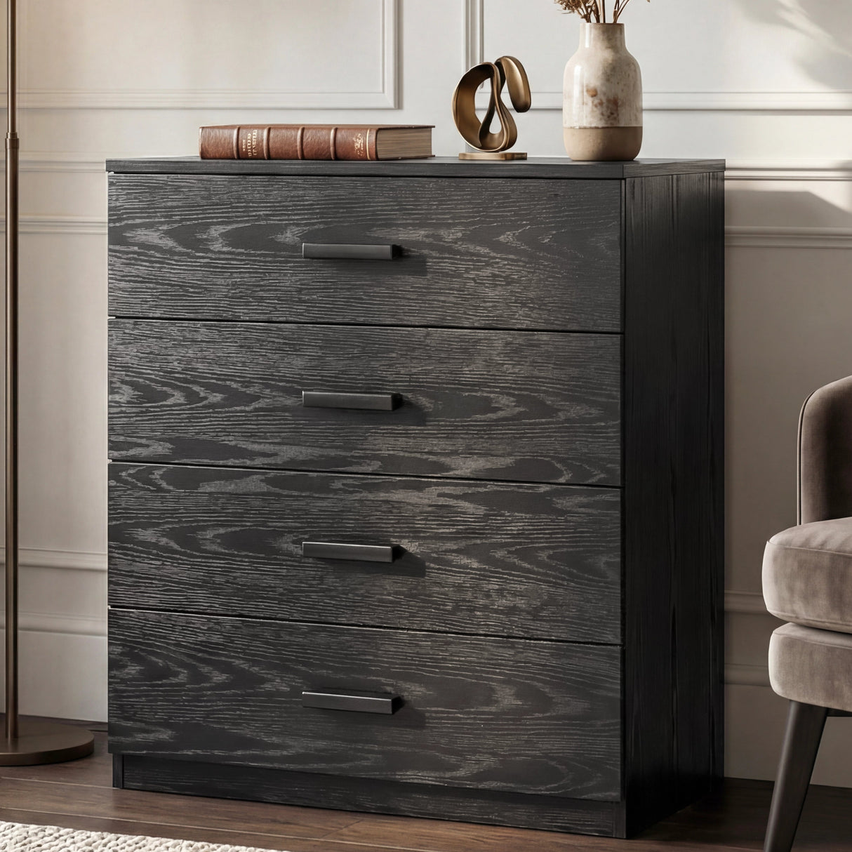 [Black] four drawer chest styled in neutral interior with floor lamp and decorative accessories
