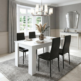 [4 Seater | Black] Black 4-6 Seater Dining Table and Chairs Set showing a white rectangular table matched with black high-back chairs on a plush grey rug in a traditional room