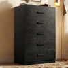 [Black] five drawer chest styled in warm interior with floor lamp, shelving, and black wooden handles