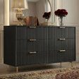 [Black] Side elevation of black 6 drawer chest with flutrina drawer fronts, golden handles and legs