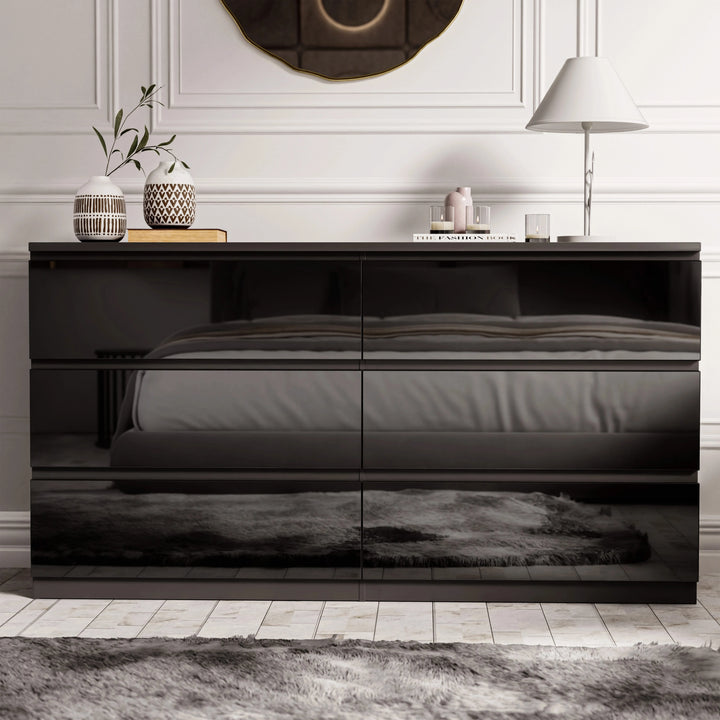 [Black] Straight-on view of black 6 drawer chest with round mirror and drum lamp behind.