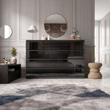 [black] wide black glossy dresser against panelled wall with geometric rug and woven stool