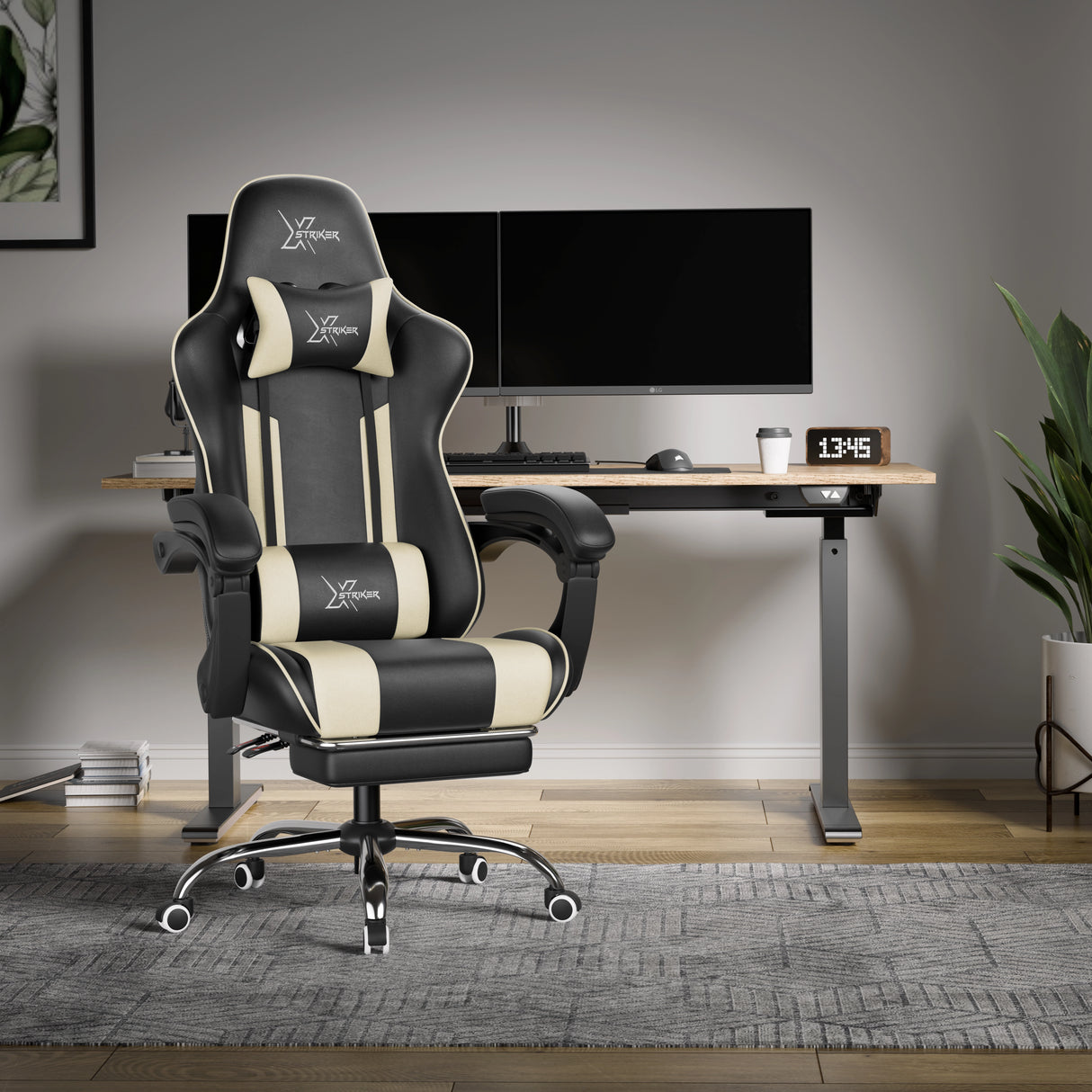 Black and white gaming chair in a modern office setup with a desk and computer monitors.