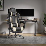 Black and white gaming chair in a modern office setup with a desk and computer monitors.