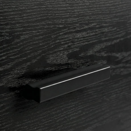 [Black] Close up of black drawer front with integrated handle detail and visible wood grain texture