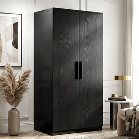 [Black] Blythe wardrobe angled view showing textured wood grain doors and matte black bar handles in a styled bedroom