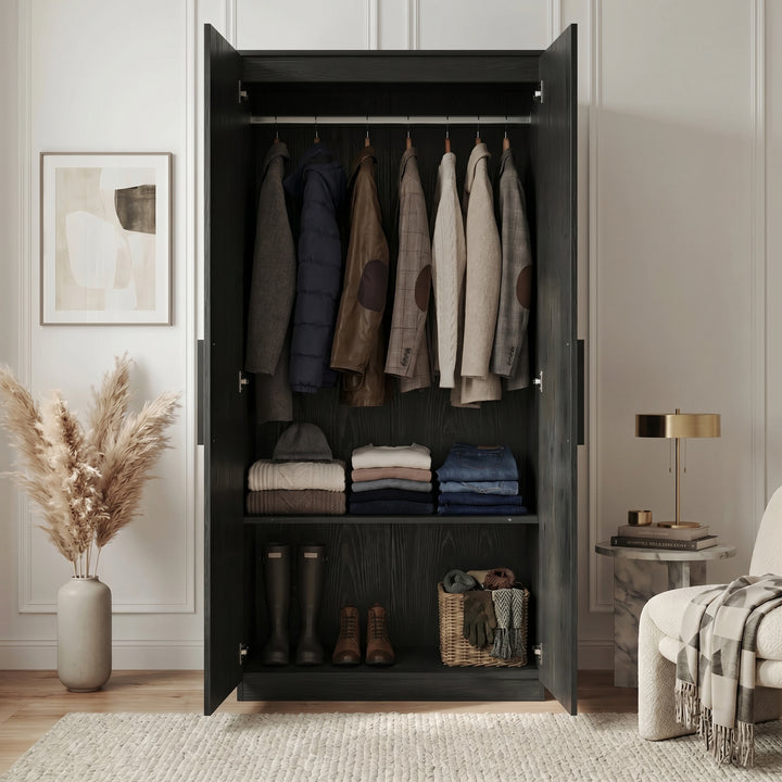 [Black] Blythe wardrobe interior with full-width hanging rail, folded clothes on mid shelf, and shoes on the lower shelf
 
