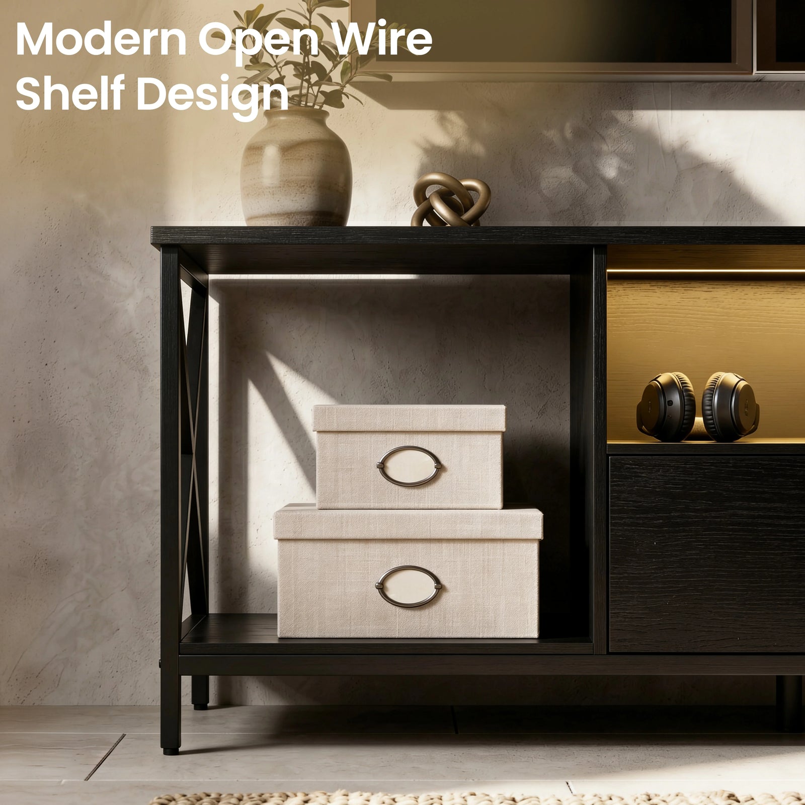 [Black] Calvera TV stand close-up of open wire shelf with linen storage boxes inside, black X-frame legs and warm LED in the centre shelf with headphones