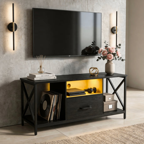 [Black] Calvera TV unit styled with wall sconces, pink flowers, gold sphere, amber LED and storage boxes in a concrete-tone room