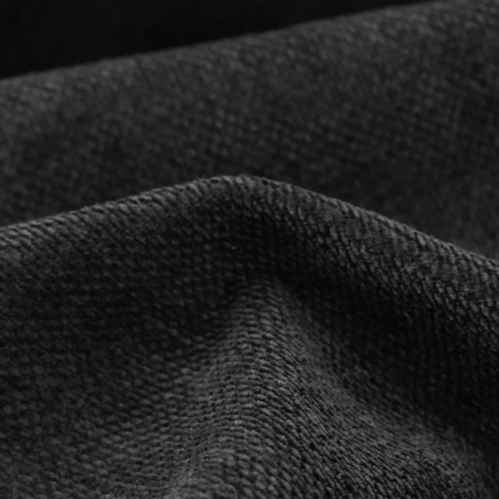 [Black | Set of 4] Comfy upholstery fabric close-up showing fine woven threads, a rounded foreground fold, and deep creases.