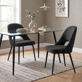 [Black | Set of 2] Pair of curved-back dining chairs at a glass table styled with plates, books and a sculptural vase.