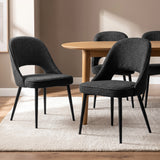 [Black | Set of 4] Four curved-back modern dining chairs with padded seats and black legs styled around a round wood table.