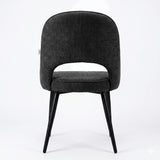 [Black | Set of 2] Rear view of the comfy black dining room chair with rounded open back, piped seat & four black metal legs.