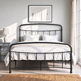 [Black | Double] Front view of a black metal bed frame with curved rails and white bedding in a bright bedroom.