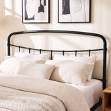 [Black | King] Close-up of the black curved headboard with vertical bars, cream pillows and layered bedding.