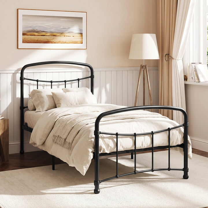 [Black | Single] Black metal bed frame with curved rails and white bedding, shown at a 3/4 Angle in bright bedroom.