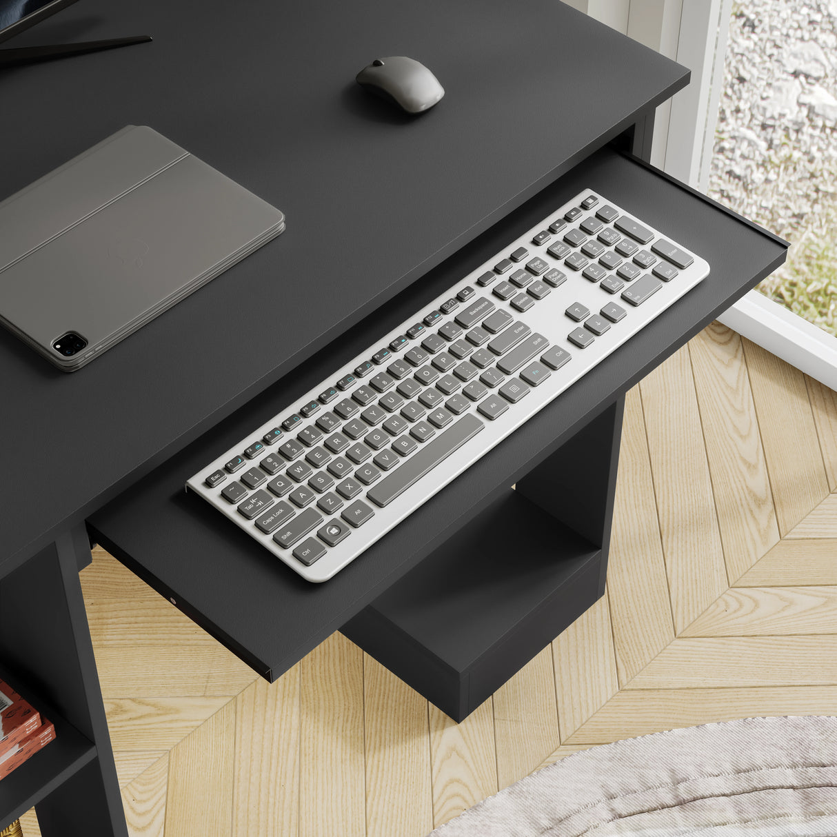 Home office computer desk with pull-out keyboard tray in black finish, featuring side shelves for storage and a compact design ideal for small spaces.