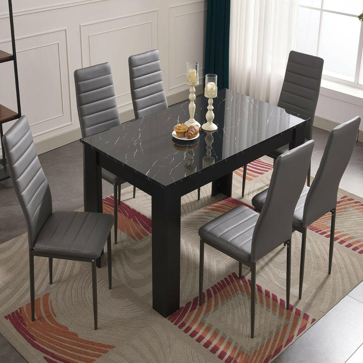 Black dining room table set with stylish design, perfect for modern dining spaces.