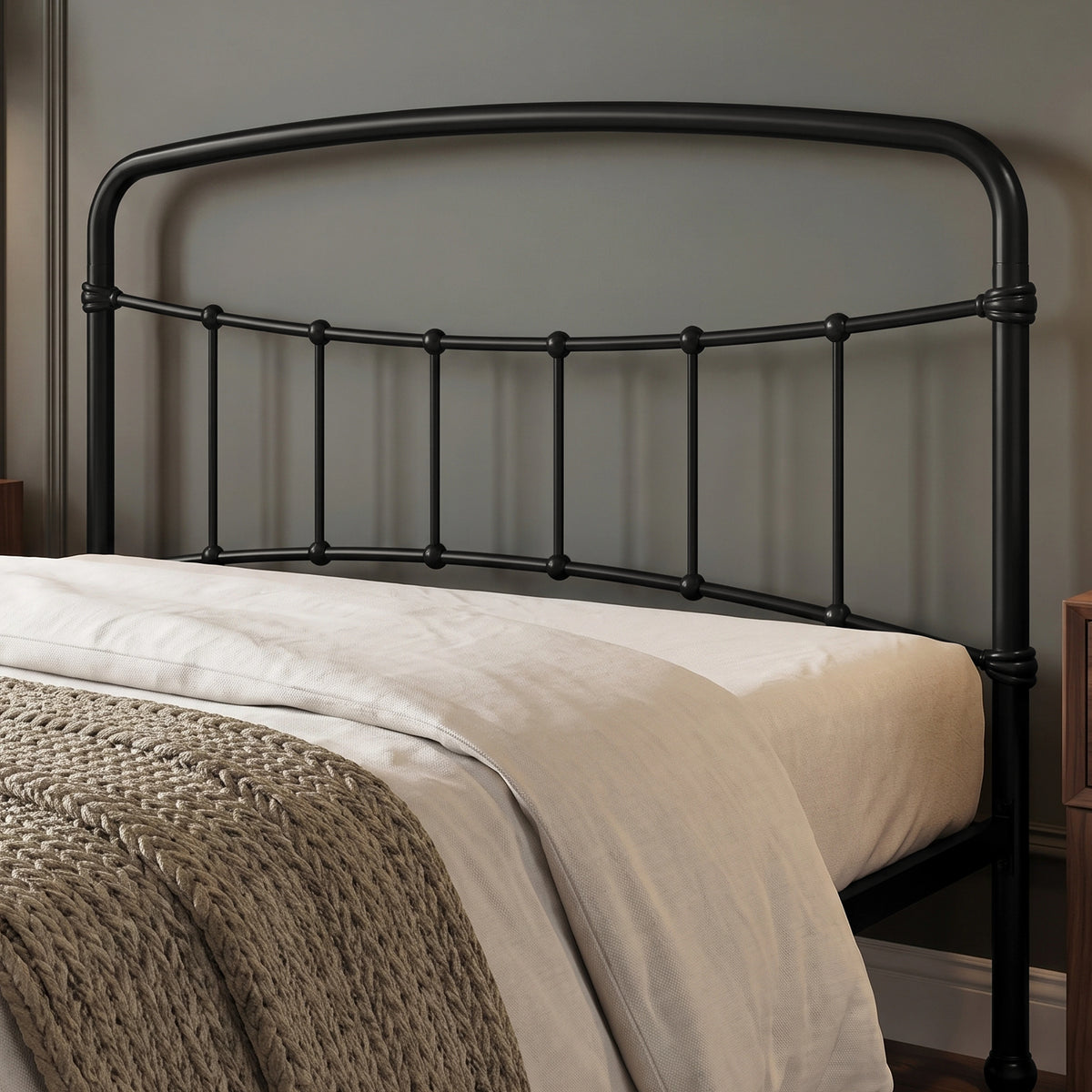 [Black | Double] Headboard close-up showing curved rail, vertical bars, ball details, wrapped joints, bedding, and throw.