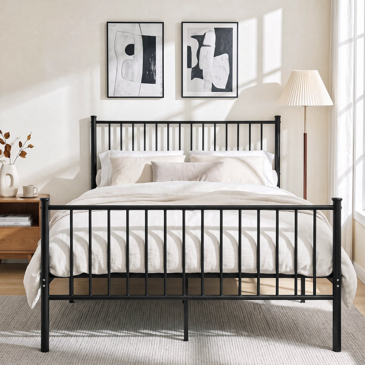 [Black | Double] Black metal bed frame with cream bedding, tall bar headboard, matching footboard and centre support legs.