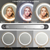 Close-up of a black dressing table with a round mirror, three different light modes, and brightness colour adjustments