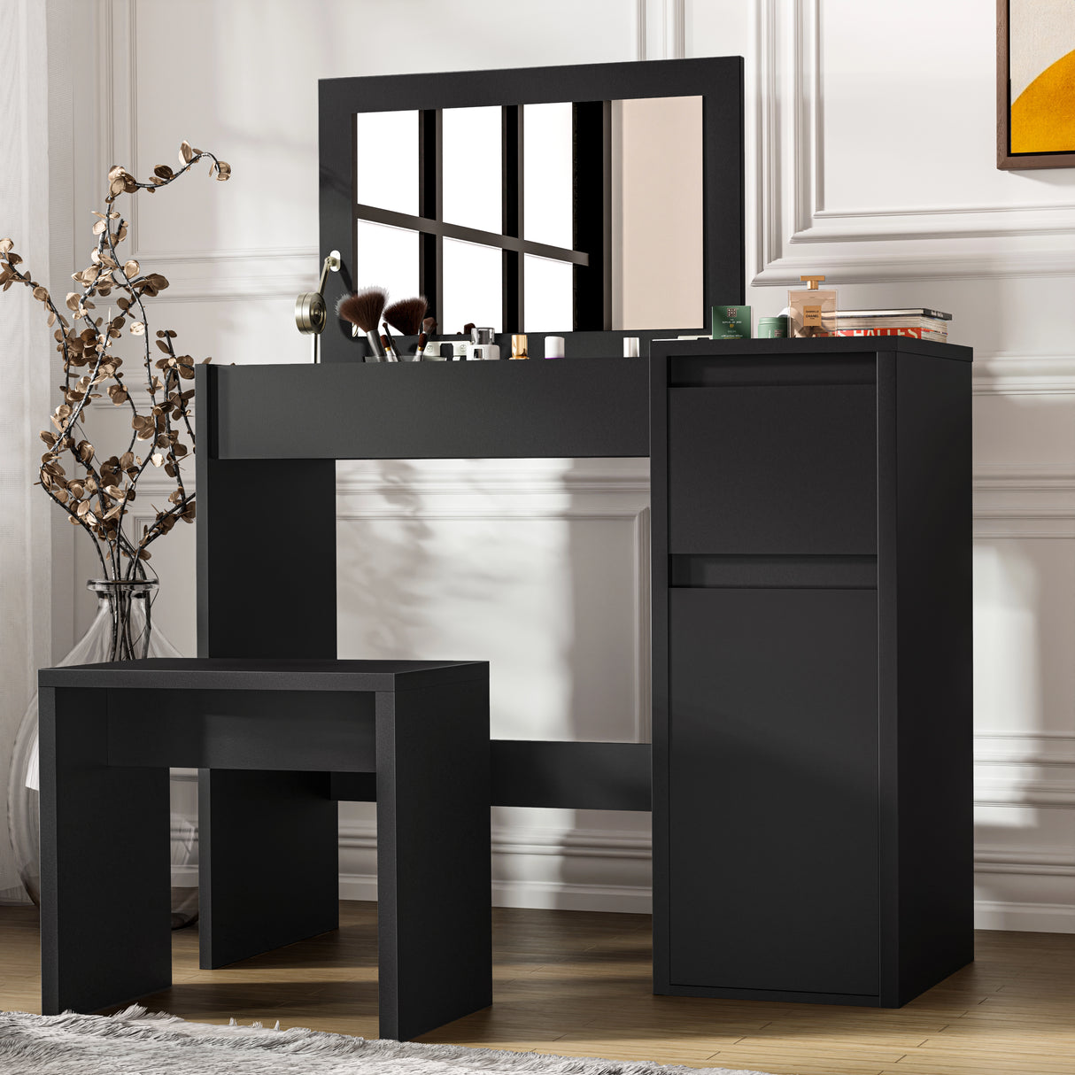 Modern black makeup dressing table with flip-up mirror, storage compartments, and matching stool for bedroom vanity setup.