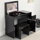 Black dressing table with storage, featuring a marble finish and multiple storage compartments.