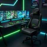 [Black] Ergonomic Gaming Chair with Headrest and Lumbar Support showcasing its sleek black design and vibrant green stitching in a dual-monitor.